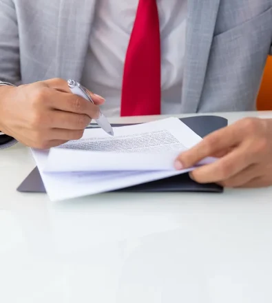 cropped-shot-businessman-signing-contract 1